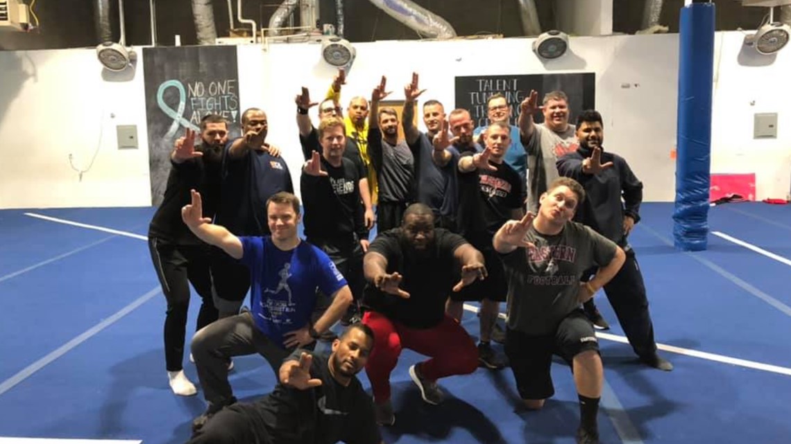 Cheer dads bond with cheerleader daughters with their own routine