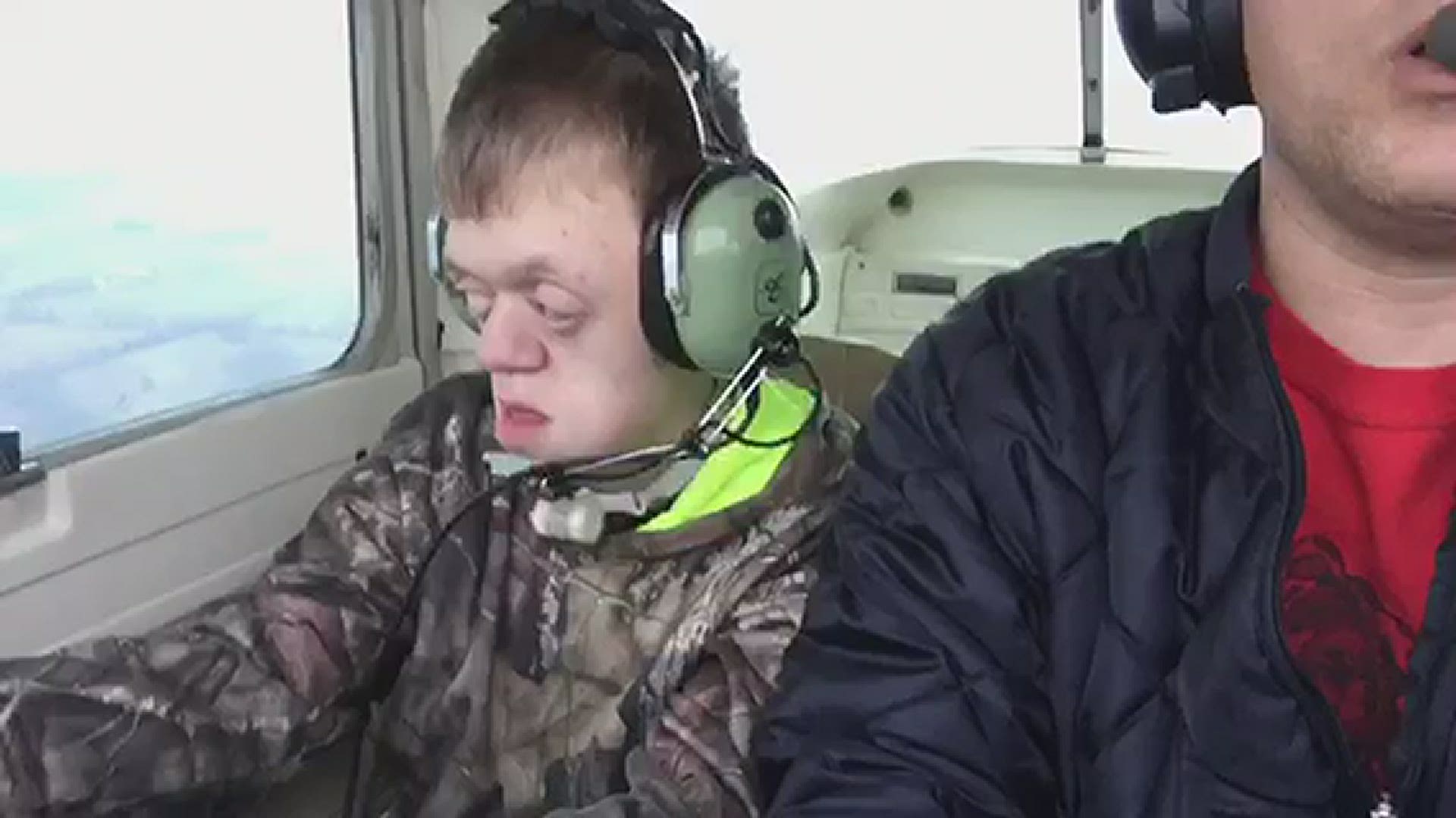 Braden West helps a family friend fly a plane.