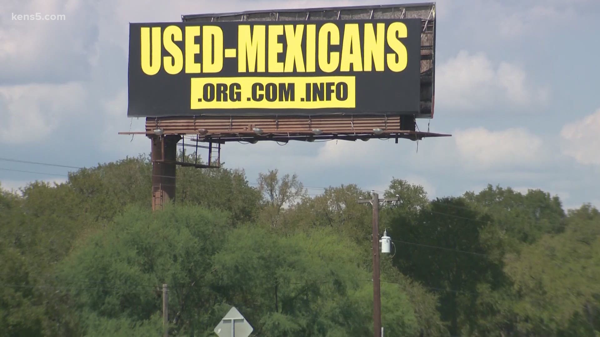 The man behind a billboard that read "USED-MEXICANS" before being taken down says he was making a political statement.