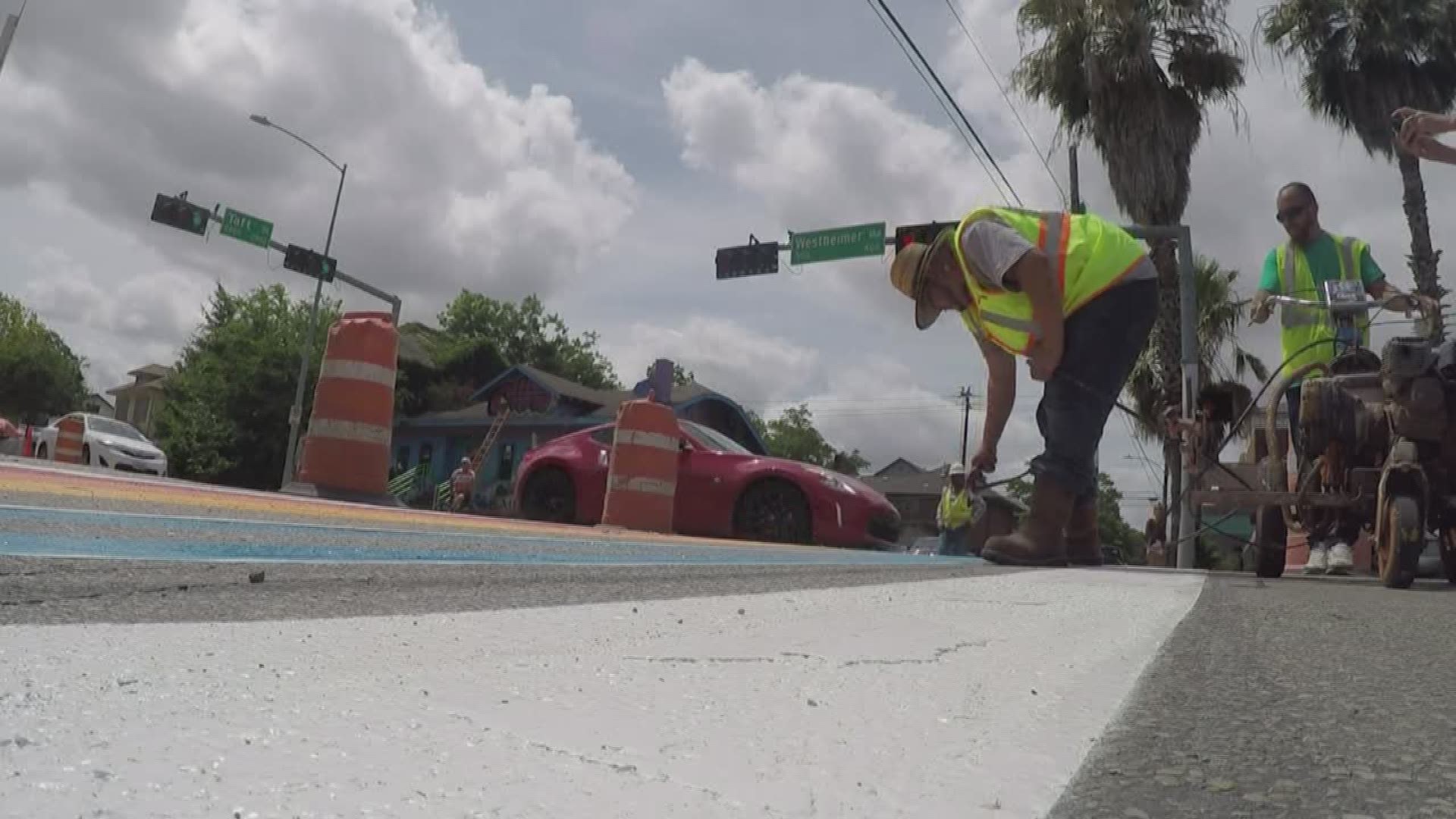 Work crews began painting a colorful crosswalk in the Montrose area on Saturday just in time for Pride week. 