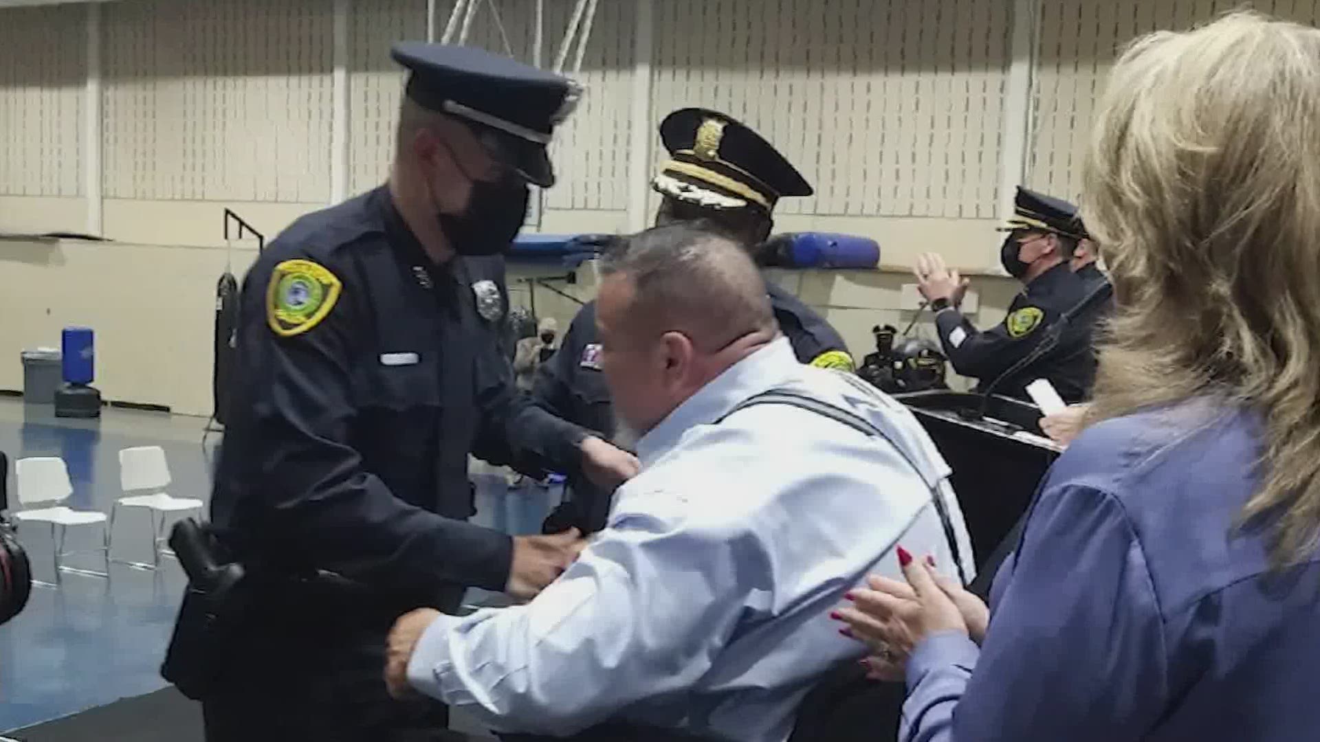 Officer Ronny Cortez beamed proudly as Evan became a police officer, and then he pinned his own badge on his son.
