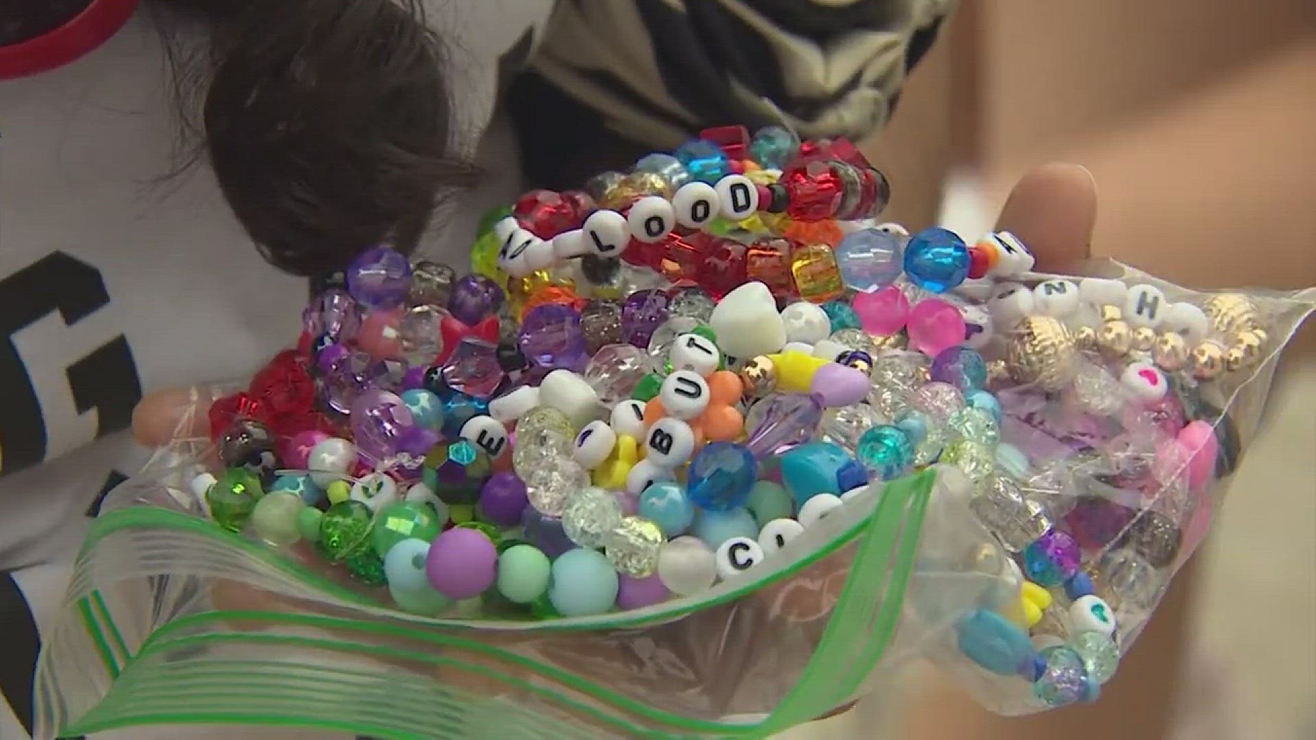 Making friendship bracelets for the tour to share with people