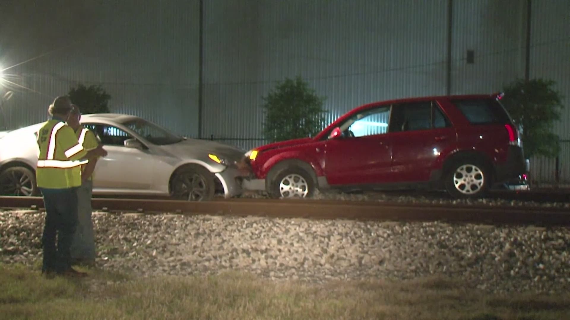Two vehicles parked on the train tracks in west Houston were struck by a Union Pacific train overnight.
