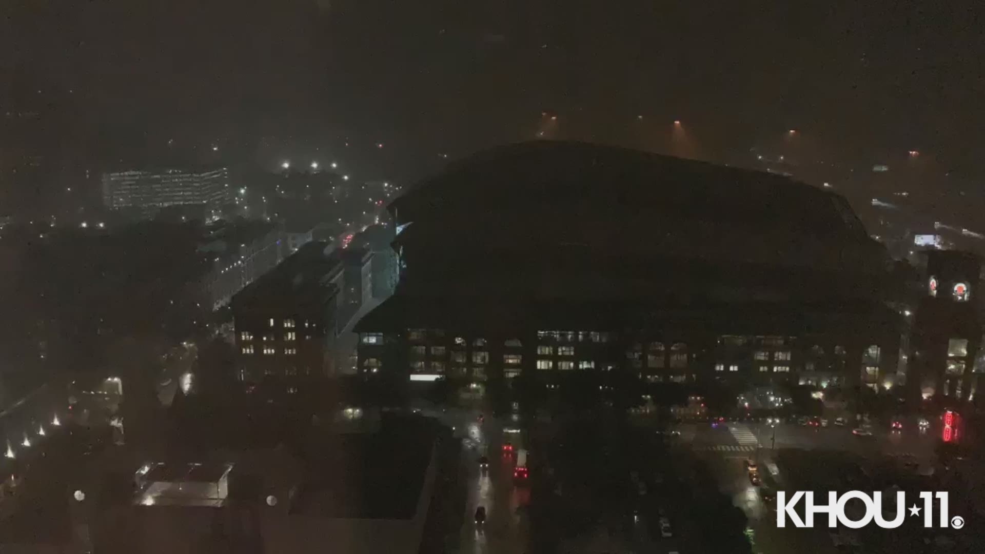 Fans took cover after it started raining inside Minute Maid Park during Thursday night game between the Astros and Rangers.
