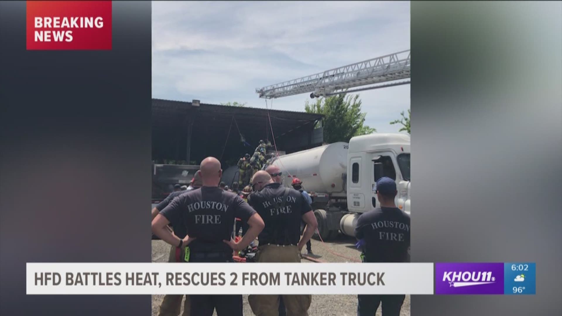 Firefighters battled the extreme temperatures as they rescued two people from a tar-filled tanker truck off Howard Drive Saturday afternoon.