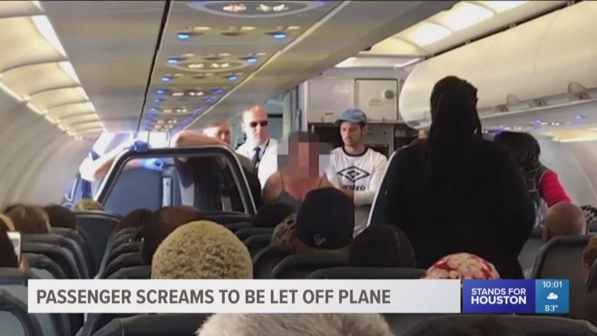 A Houston flight to Minneapolis took a terrifying turn when the plane had to be diverted and a passenger started screaming to be let off the plane. 