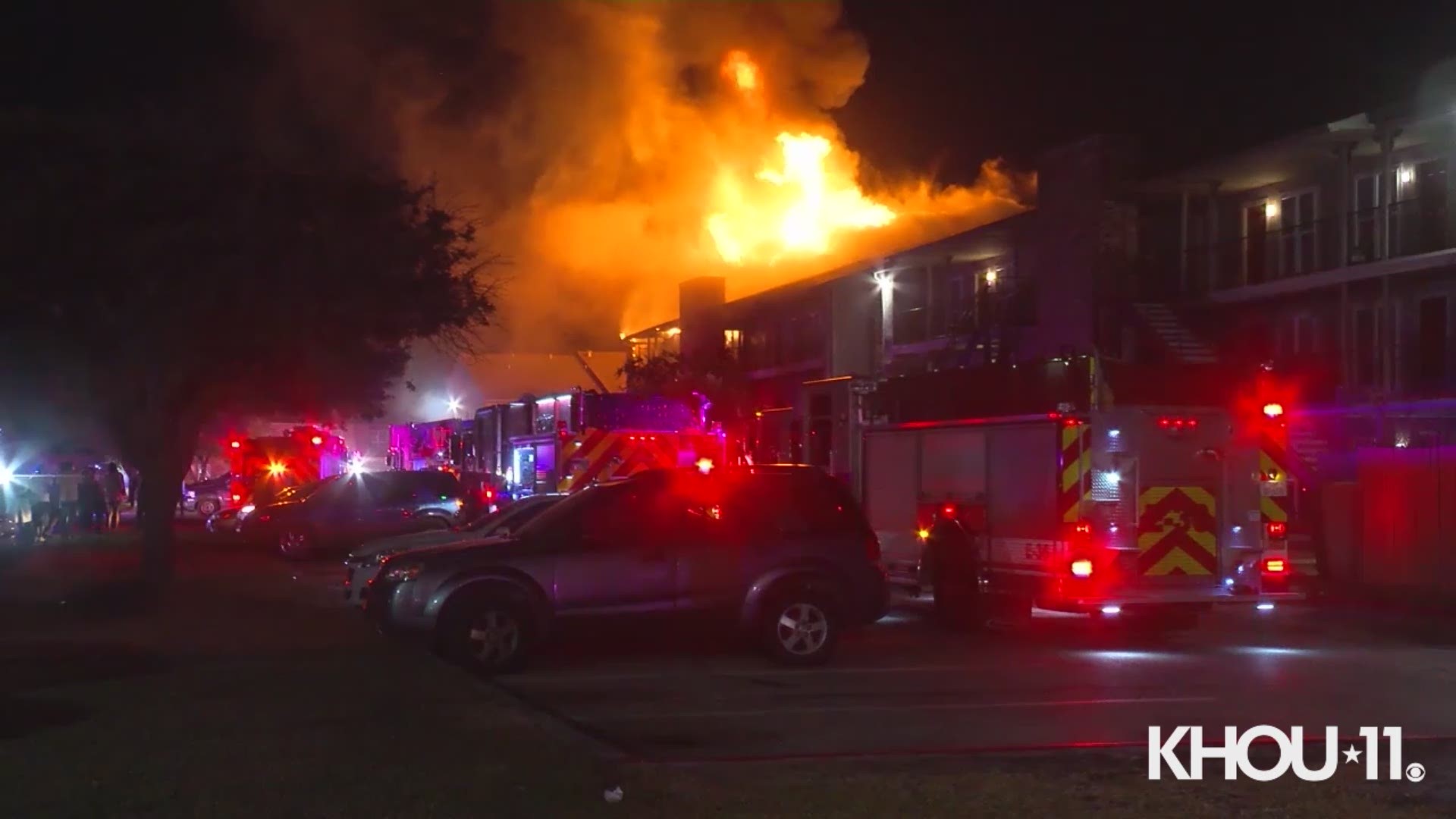 Firefighters are battling a two-alarm apartment fire in northeast Harris County early Friday.