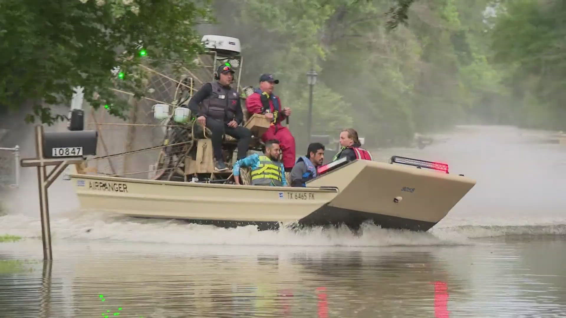 Rescue crews on boats got people out to safety after water left the roads impassible.