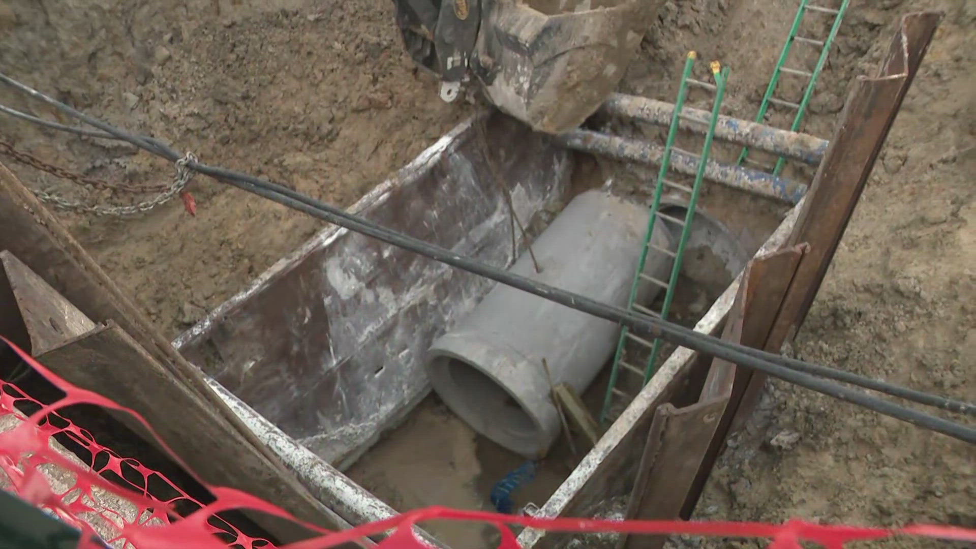 The man was stuck between a concrete pipe and a steel trench box and had to be rescued from about a 20-foot-deep hole at a worksite in the Meyerland area.