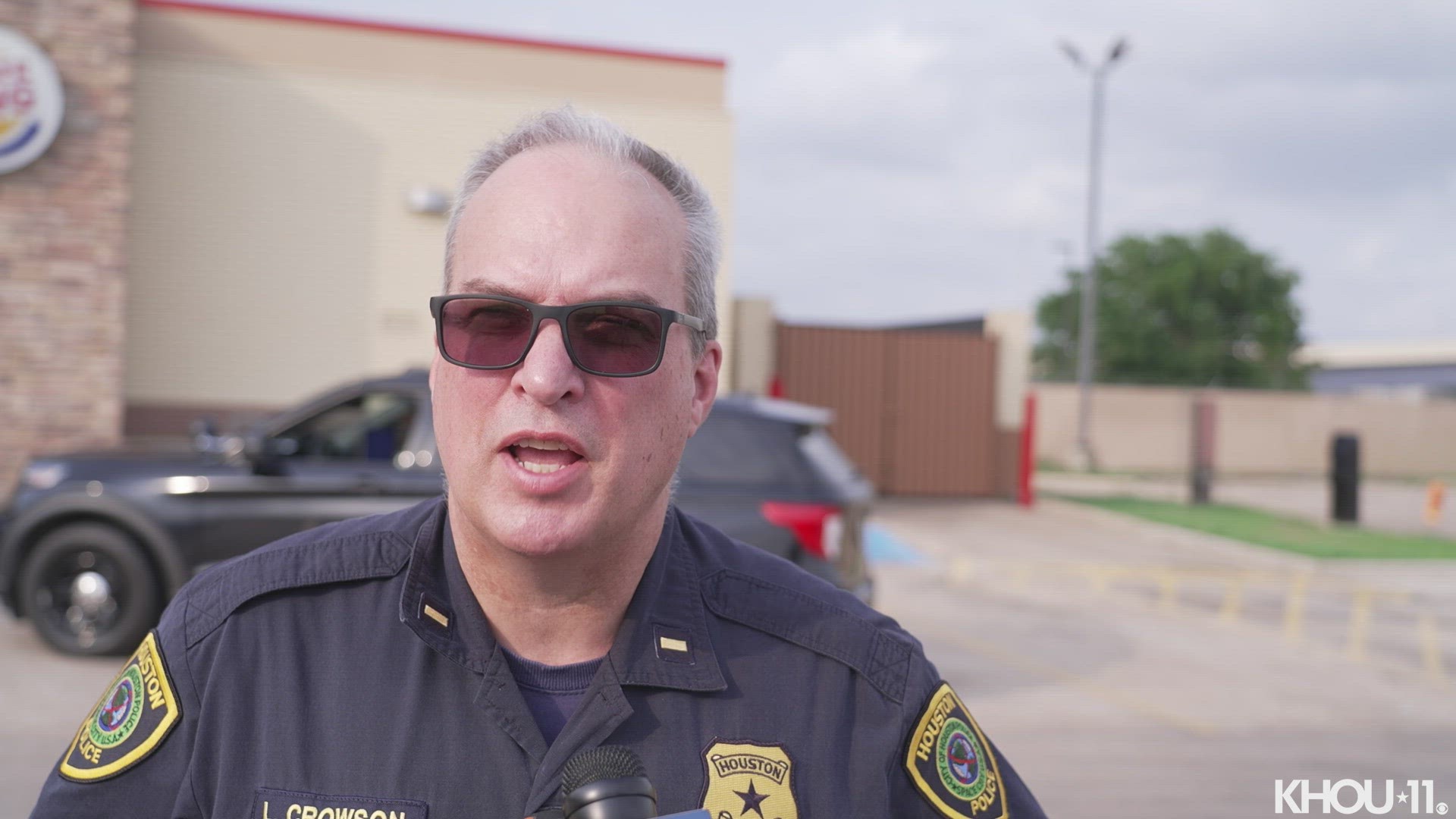 The motorcyclist was riding on the Holcombe exit ramp when he crashed into a wall and flew off his bike, He then landed on top of a deputy's patrol unit, police say.