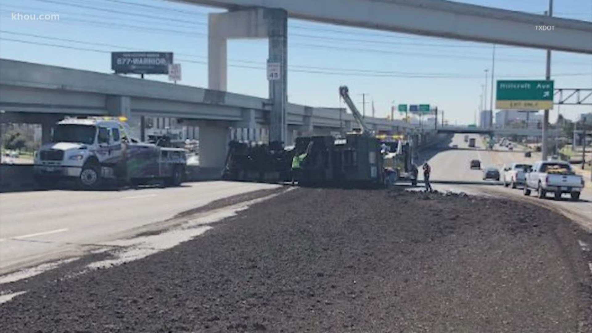 A truck carrying raw sewage overturned on the Southwest Freeway Friday afternoon making a mess of rush hour traffic.