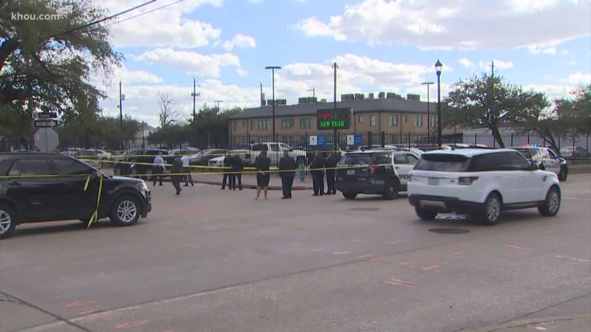 An armed robber was shot by a Houston police officer after investigators claimed the robber raised his gun at the officer.