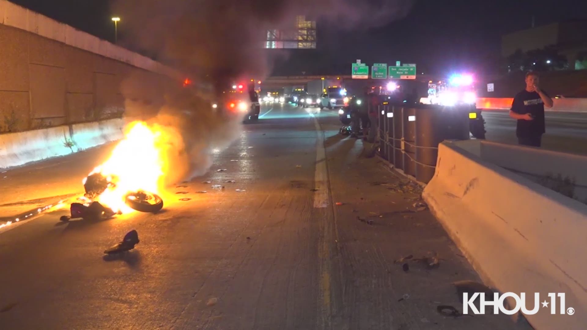 A motorcycle burst into flames during a fiery crash on the East Freeway near downtown Houston Wednesday night.