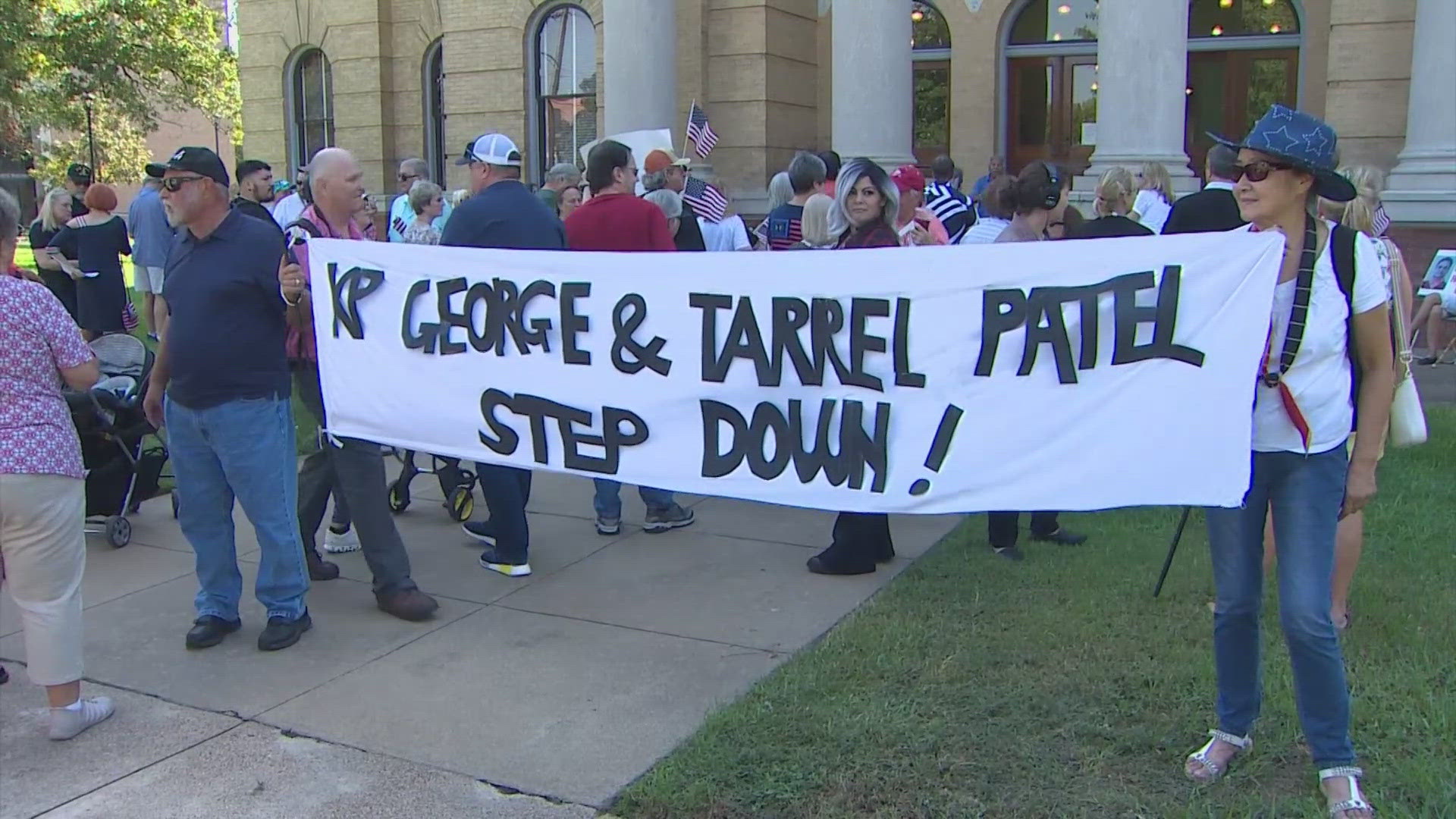 Dozens gathered outside the Fort Bend County Courthouse on Tuesday calling for Judge KP George to step down from his position amid a criminal investigation.