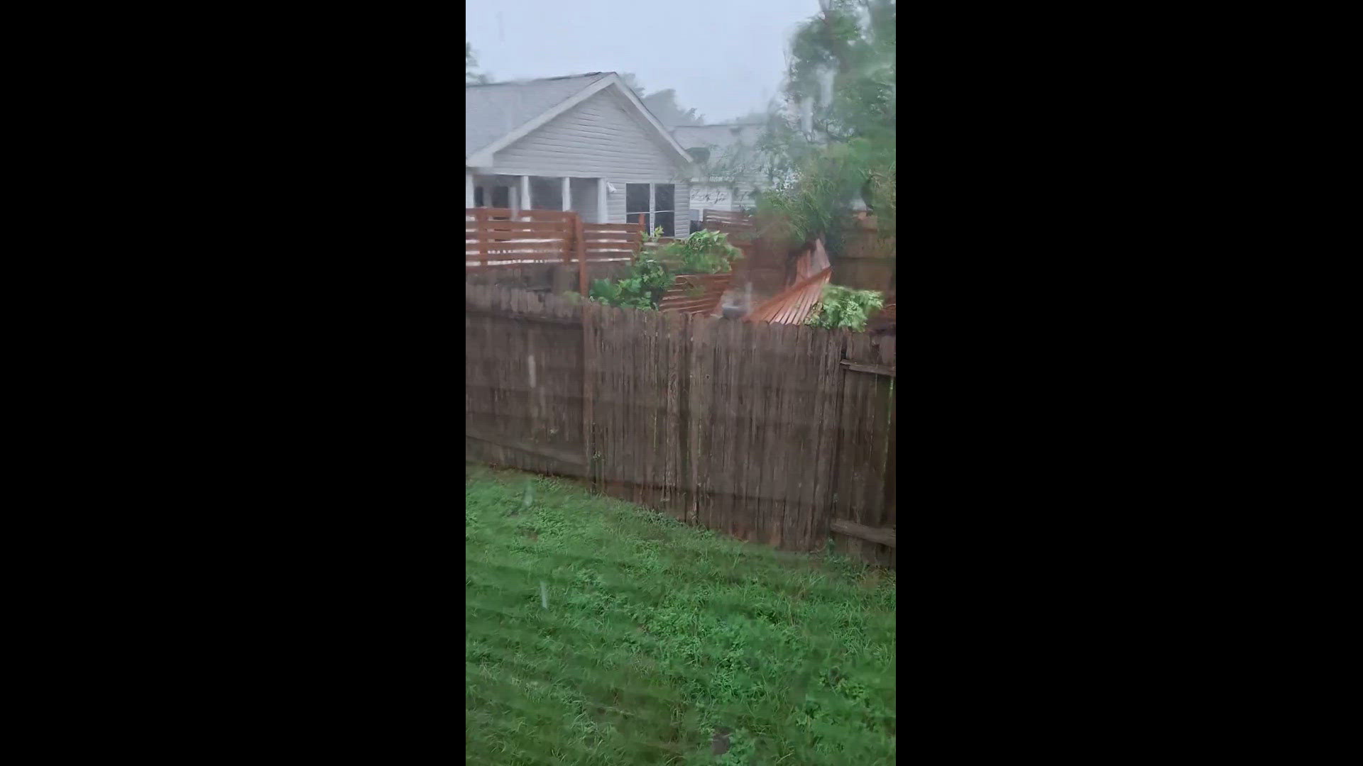 A fence blew down in a Tomball neighborhood, and the top of  a tree blew off near 99 and Champions Forest.