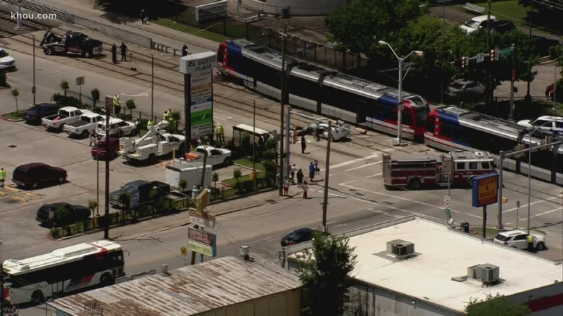 Two people were injured when a car collided with a METRO Rail train in north Houston Wednesday morning.