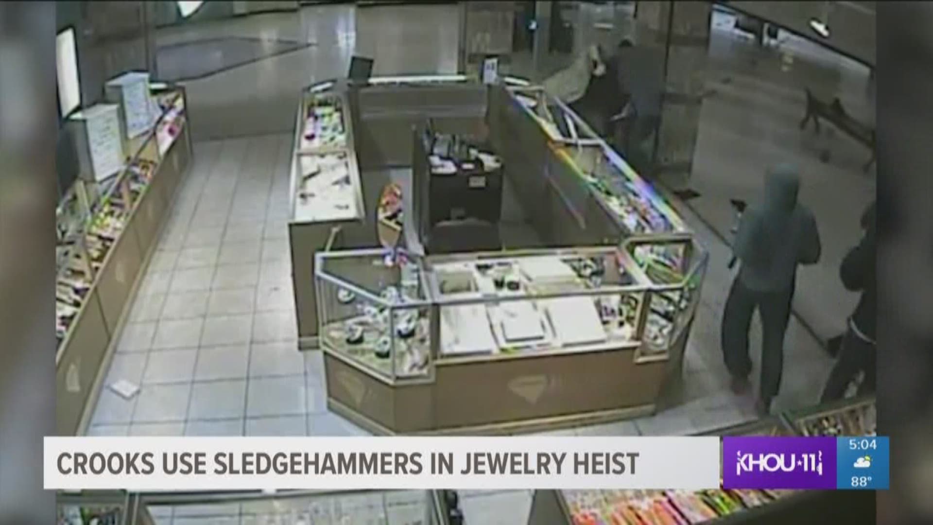 Houston Police are looking for four suspects caught on camera robbing a southwest Houston jewelry store with sledgehammers and assaulting one of the employees.