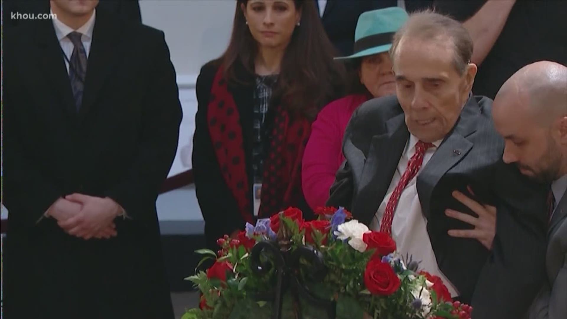 Former Sen. Bob Dole stood from his wheelchair to salute President George H.W. Bush's casket, and some Houstonians witnessed the touching moment at the U.S. Capitol.