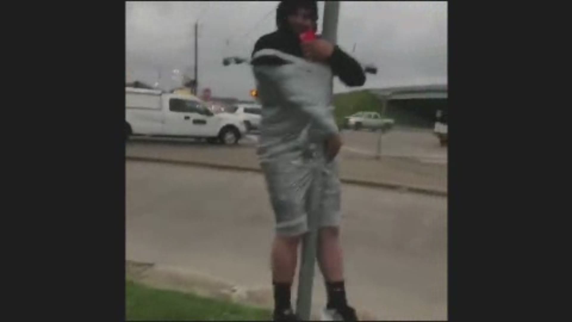 Drivers in northeast Houston were doing double takes Wednesday when they spotted some poor guy duct-taped to a yield sign. Somebody called the cops and they pulled up just in time to see a guy with a knife approach the man.
