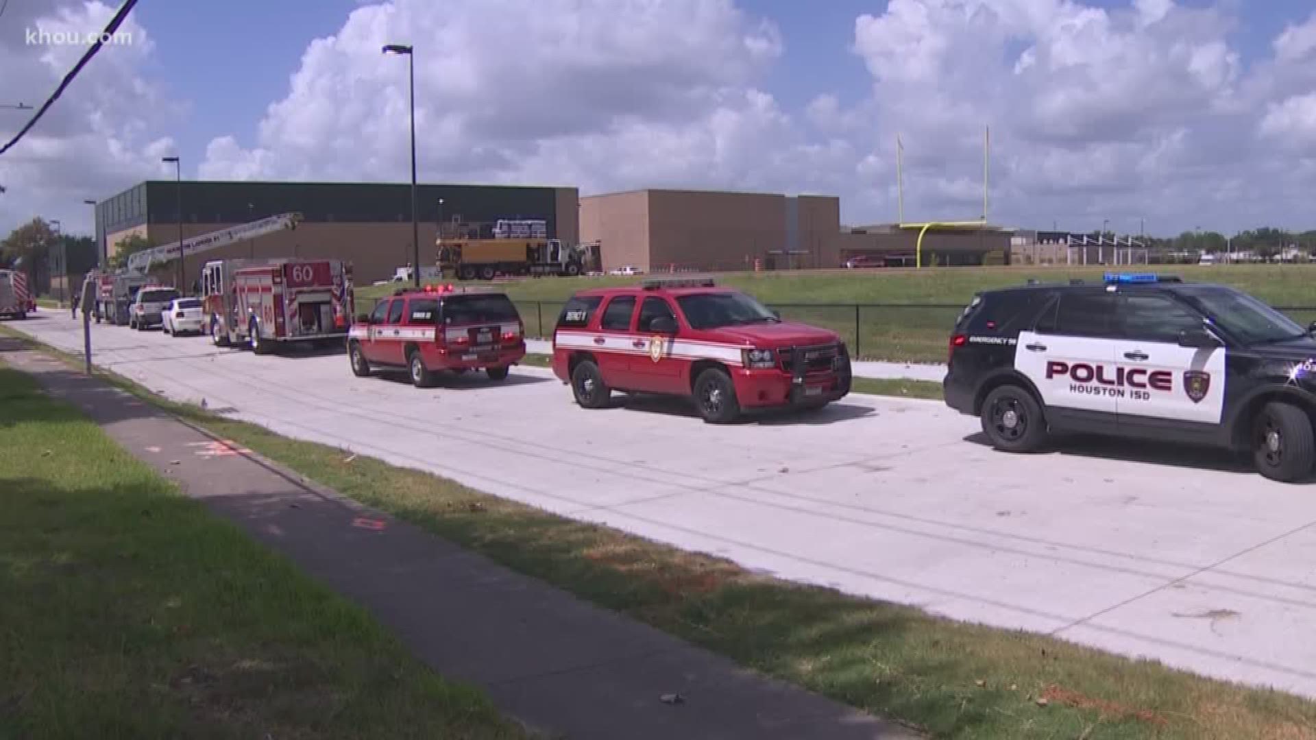 Two men died while working with a tank truck outside Wisdom High School on Monday, the Houston Fire Department said.