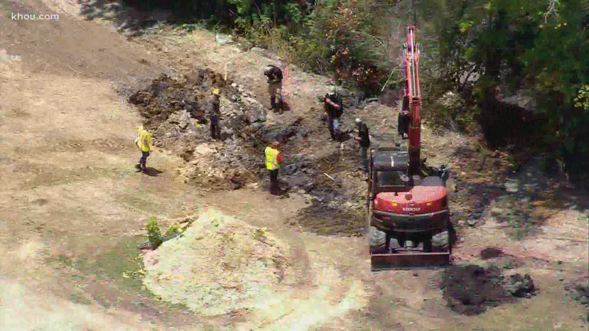 Officials were in the Crosby area Friday where deputies said thousands of gallons of oil have been illegally buried.