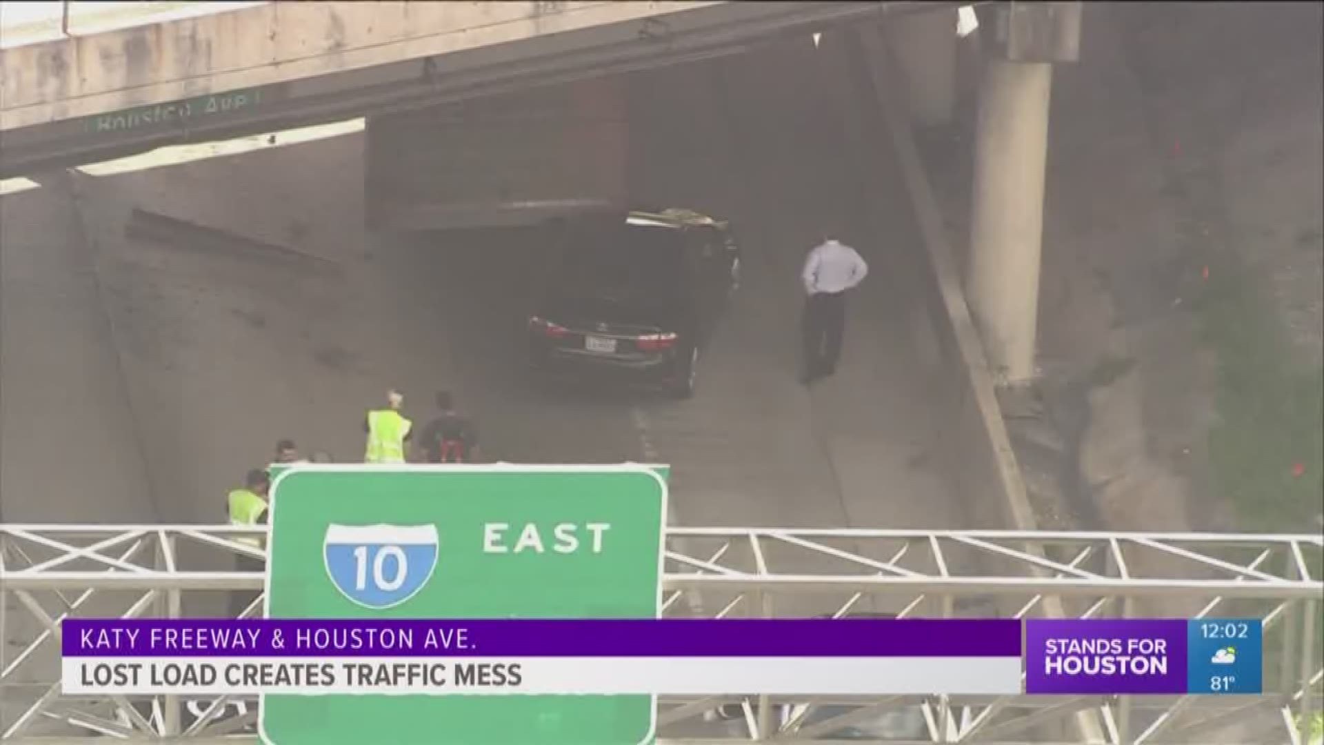 Two lanes are blocked on the Katy Freeway after an over-height, heavy truck struck the Houston Avenue Bridge, losing its cargo load in the process.