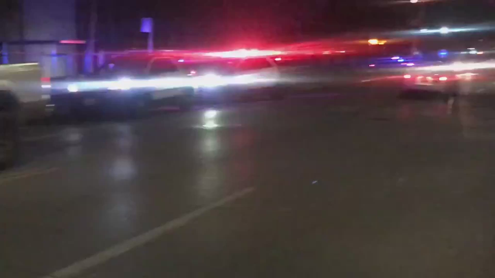Police lights light up the street where a Houston police officer was shot and killed Saturday night.
