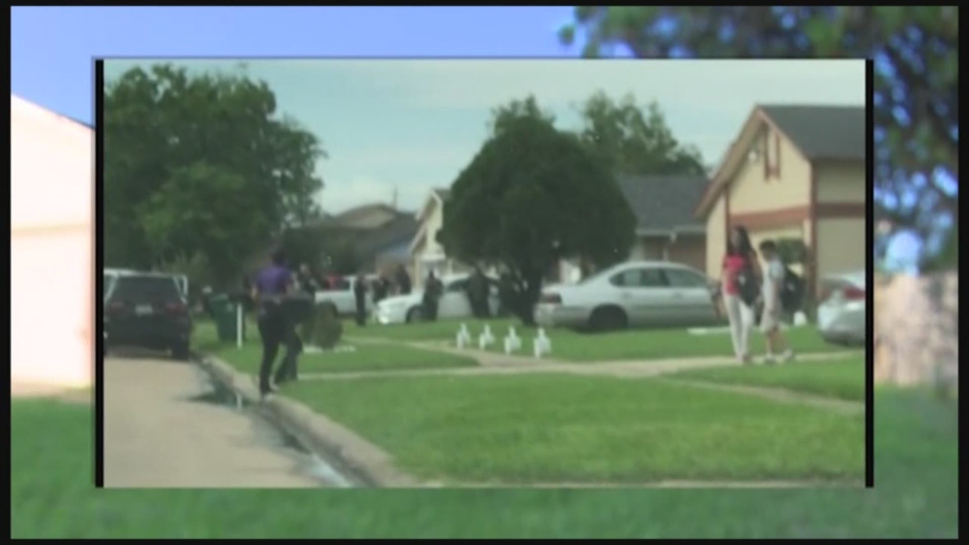 Neighbors captured the moments when Houston Police officers raided a vacant home where there was 600 pounds of drugs inside. 