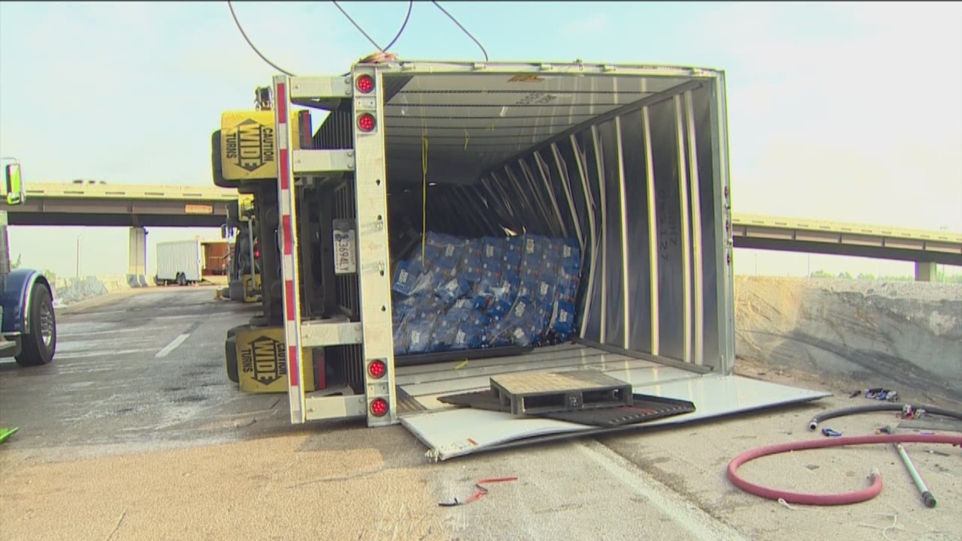 An 18-wheeler carrying loads of beer overturned, shutting down the northbound exit from the Eastex to the North Loop heading westbound.