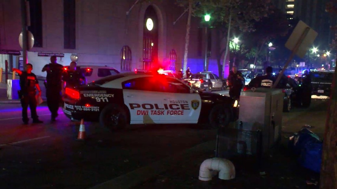 HPD officers struck by vehicle while directing traffic downtown | khou.com