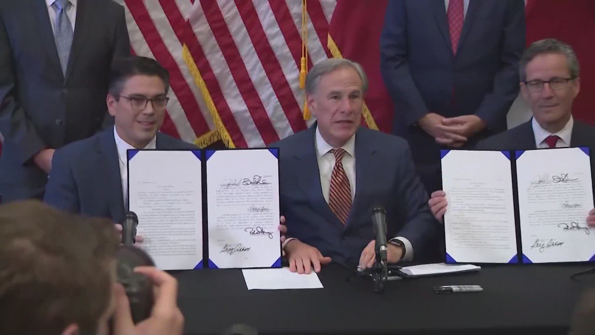 Gov. Greg Abbott on Tuesday signed two bills aimed at preventing another power grid failure, a promise he made after February’s deadly winter storm.