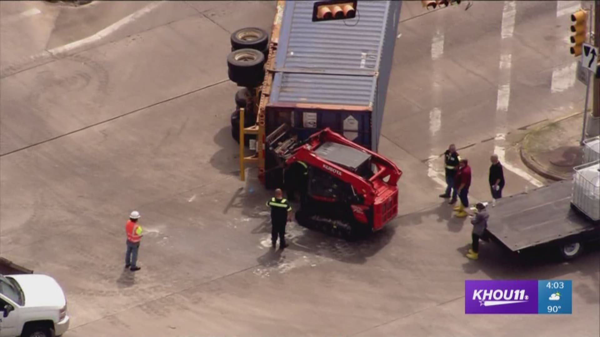 An overturned 18-wheeler is slowing traffic just northeast of downtown.