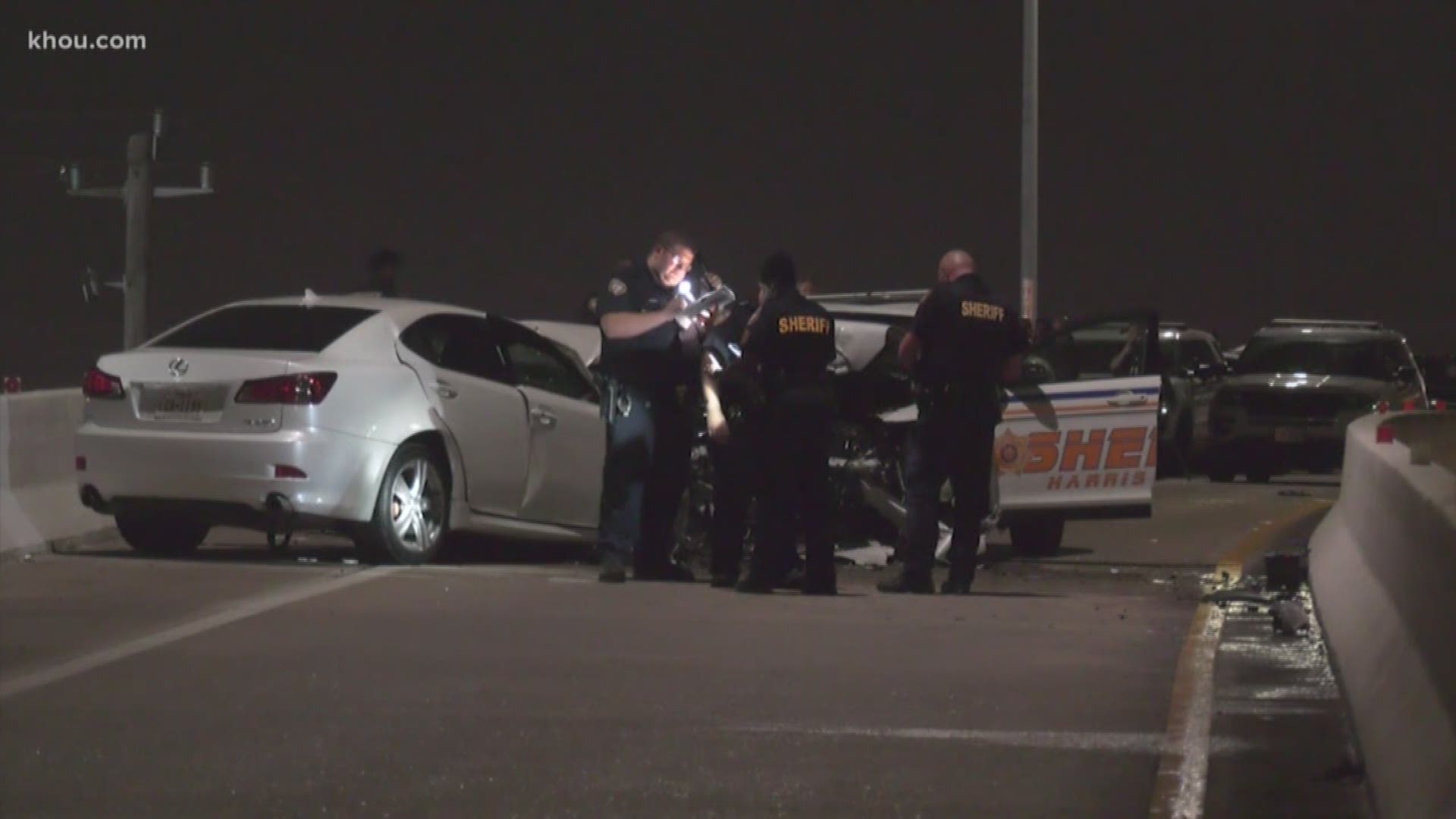 Two deputies were injured and a prisoner died after their SUV was struck by a suspected drunken driver going the wrong way in west Harris County overnight, the sheriff confirmed.