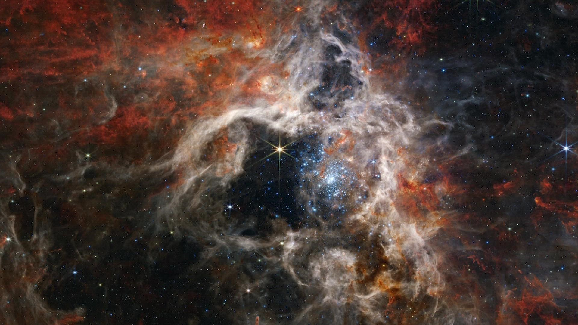 NASA says the Tarantula Nebula is known as the 30 Doradus but is nicknamed since the region “resembles a burrowing tarantula’s home, lined with its silk."
