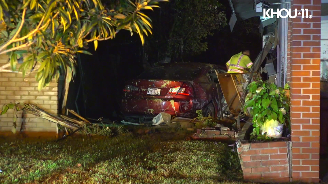 Car crashes between two houses in southwest Houston | khou.com