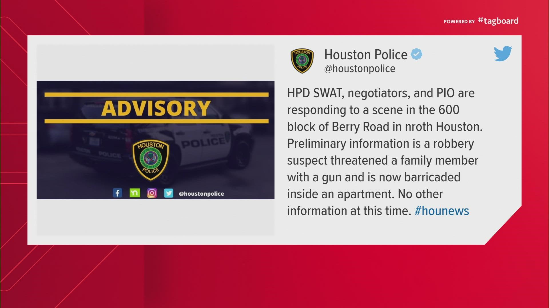 SWAT responded to a robbery suspect who barricaded themselves inside a north Houston apartment after threatening a family member with a gun.