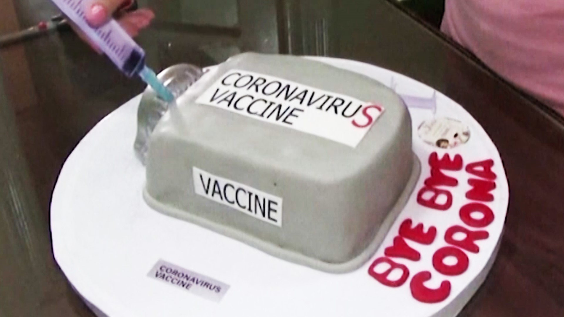 A baker in Egypt made this coronavirus vaccine-inspired cake to mark a year of the pandemic and spread some hope.