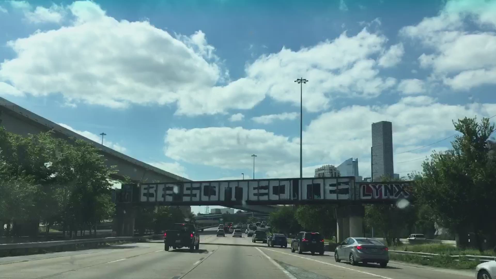 Someone has repainted the 'Be Someone' sign over the train bridge on I-45 near downtown.