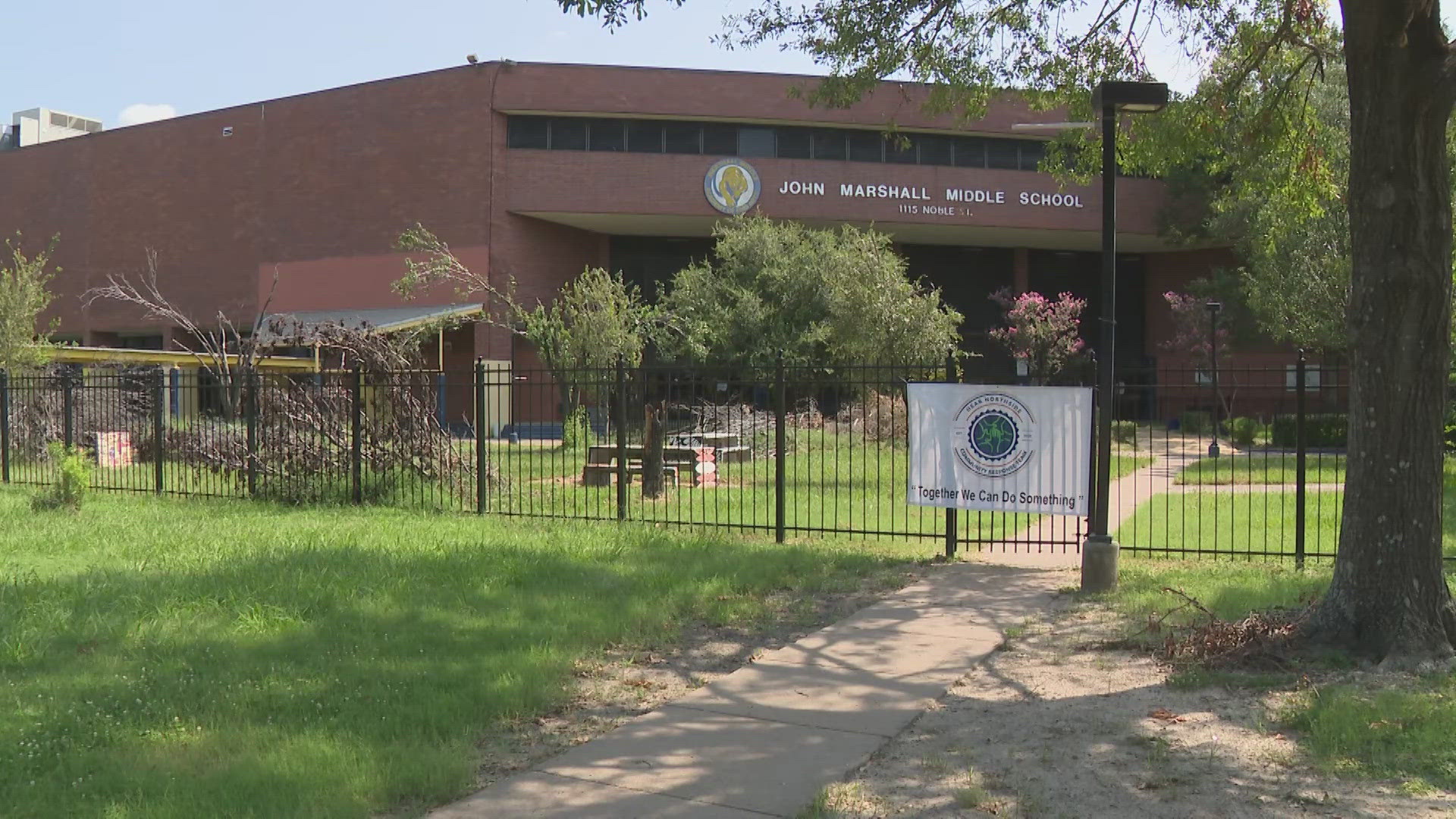 The community took matters into their own hands after seeing the Marshall Middle School campus full of tree limbs and tall grass.