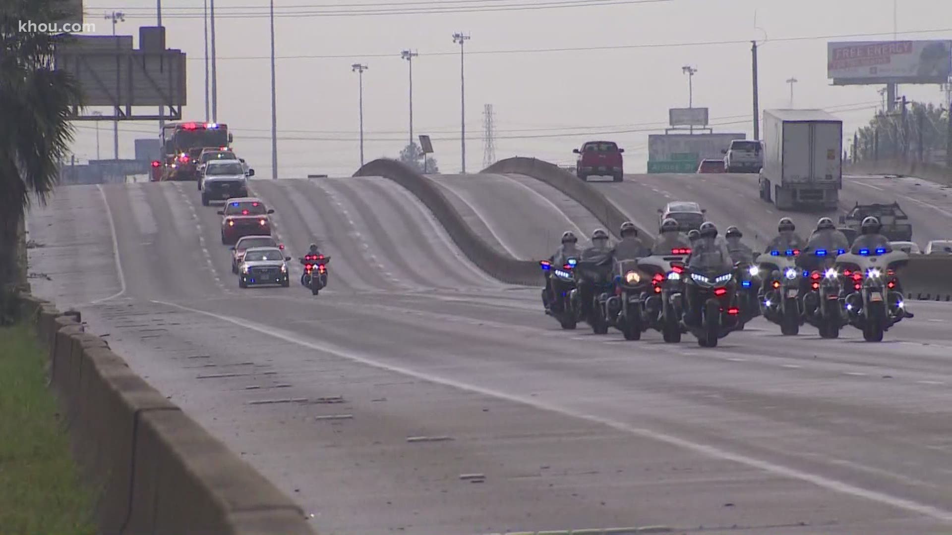 Houston firefighters honored fallen arson investigator Lemuel Bruce with a procession Monday from the medical examiner's office to the funeral home.