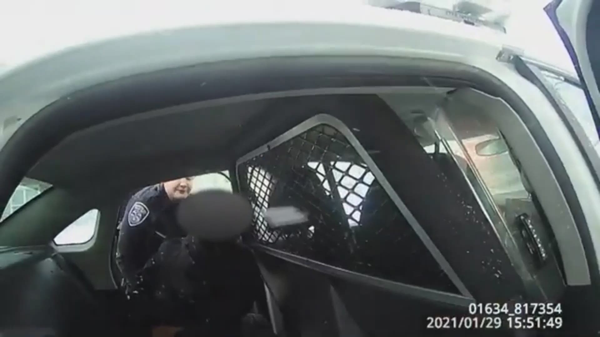 Police bodycam footage shows officers in Rochester, New York pepper spraying a 9-year-old girl handcuffed in the back of a police car and crying for her father.