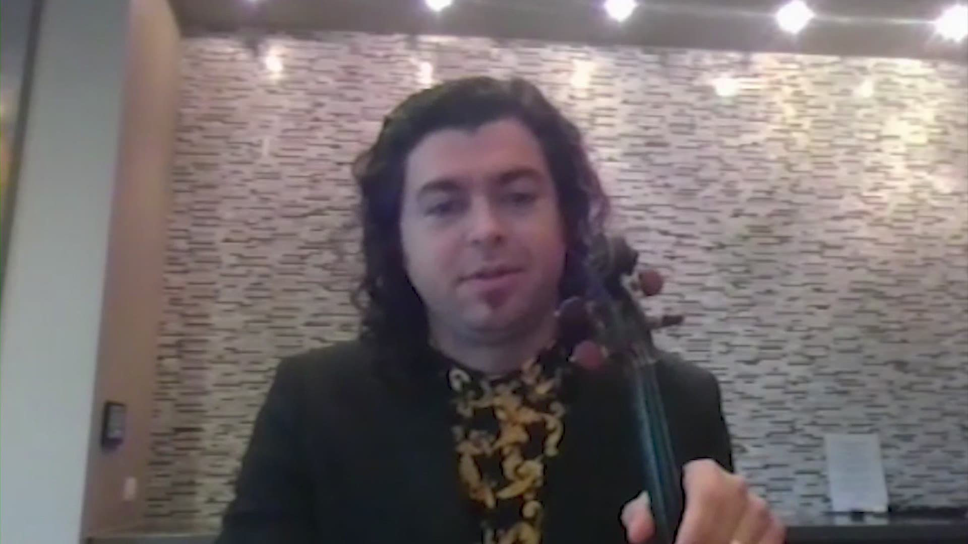 You can hire violinist Alberto Graulau to perform for your special someone via Zoom.
