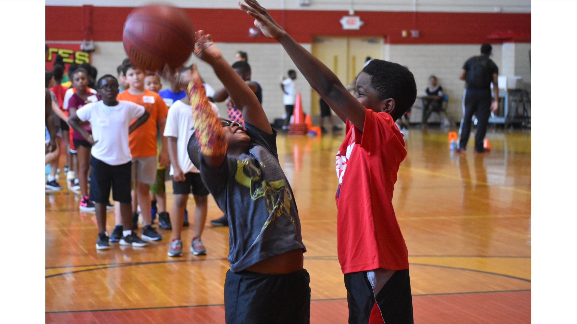 Kids learn basketball skills during Matt Musil's Hoops for Kids camp