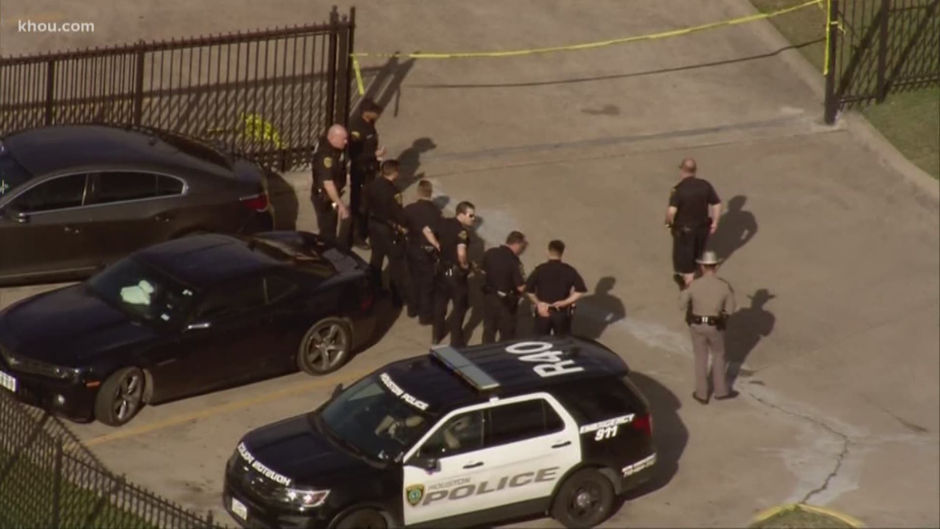 An armed man was shot by two police officers Tuesday morning in a hotel parking lot, according to the Houston Police Department.