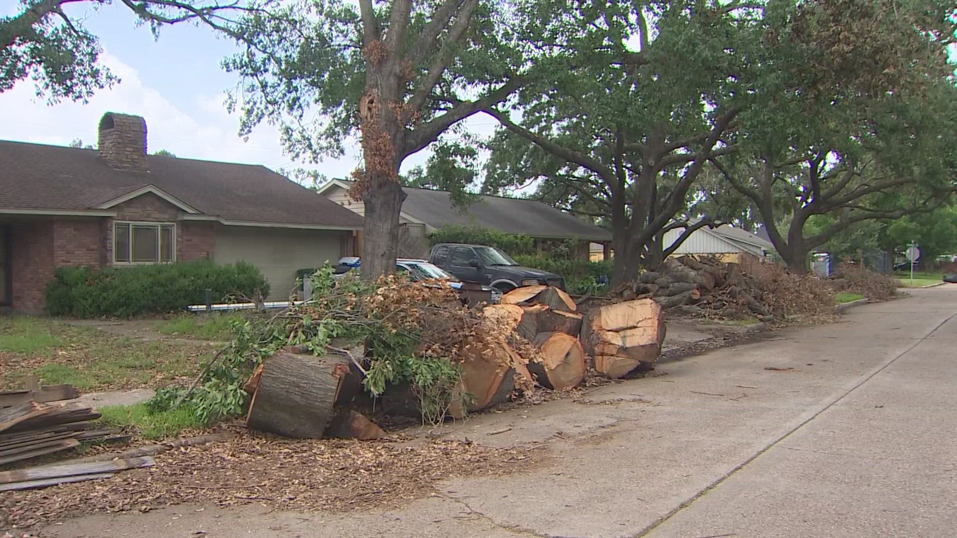 Piles of debris can be seen across the Timbergrove Manor neighborhood and folks patience is running thin.