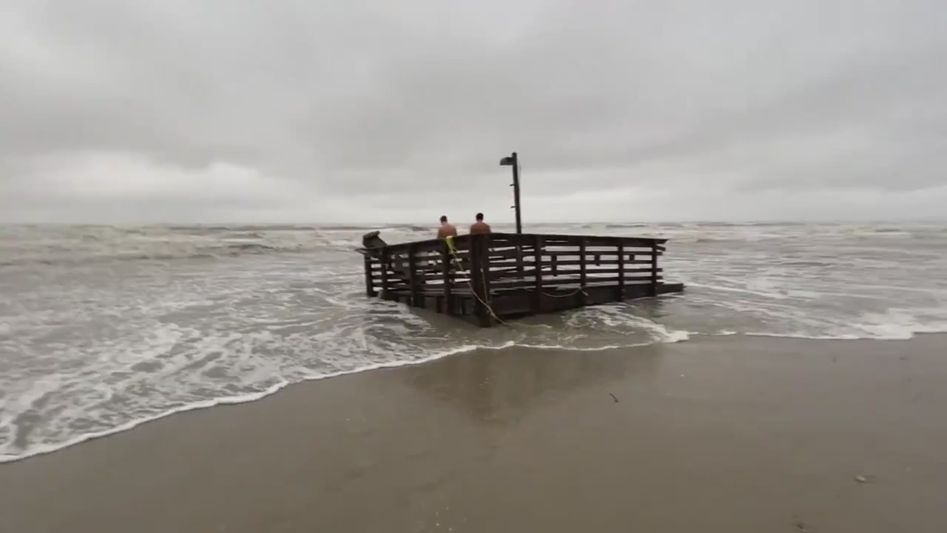 On a live stream, thousands of viewers watched the waves pummel the pier until this section of it washed away.