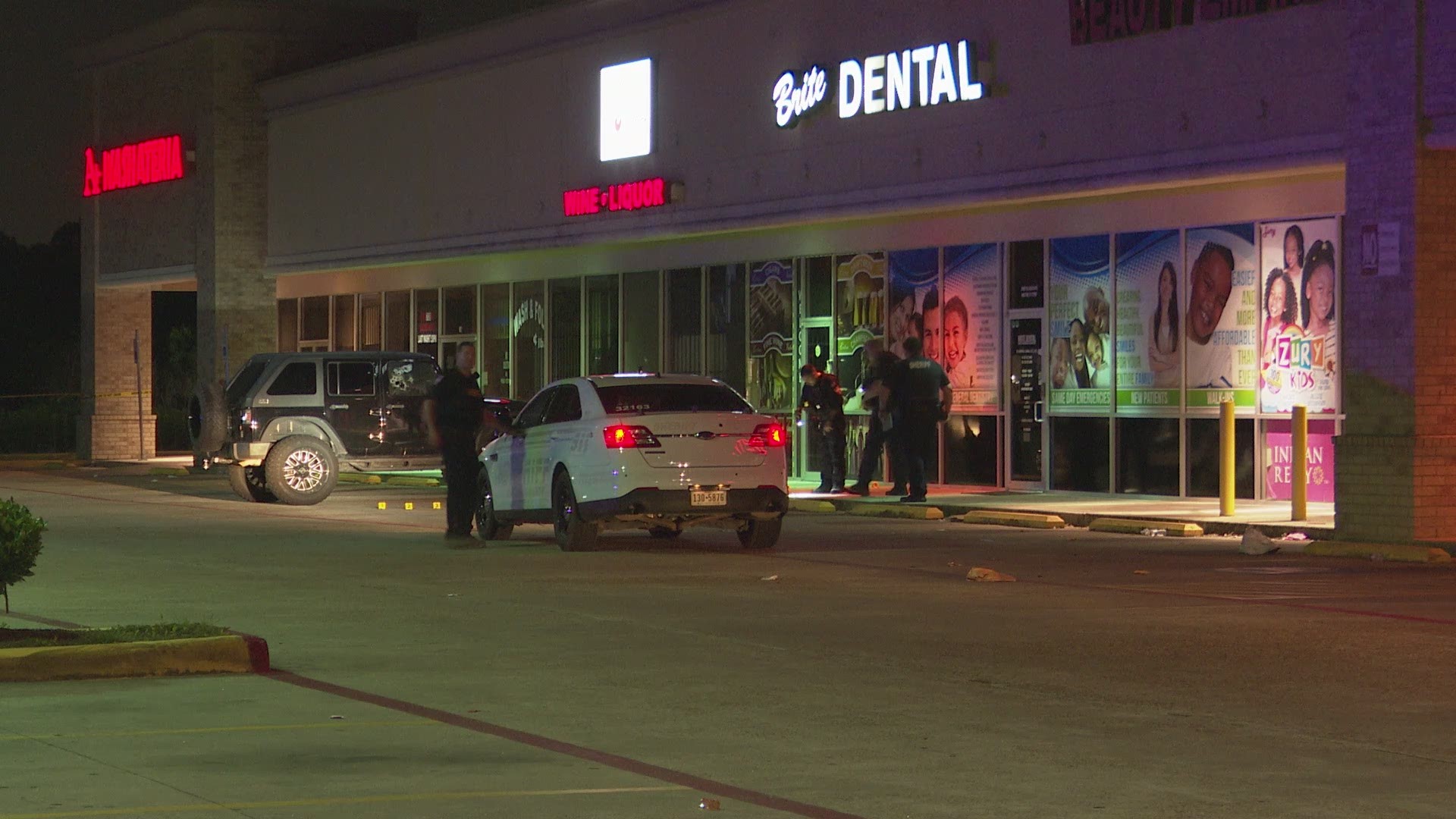At least two people were injured Saturday night during an apparent attempted robbery and shooting outside a liquor store in north Harris County.