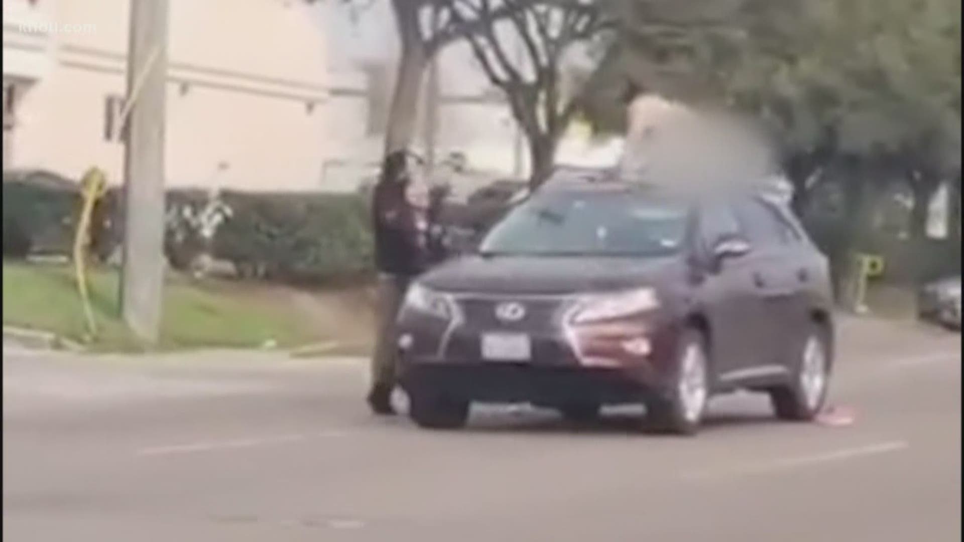 A bizarre moment caught on camera. A man was seen jumping onto a car in traffic and then taking off all his clothes.