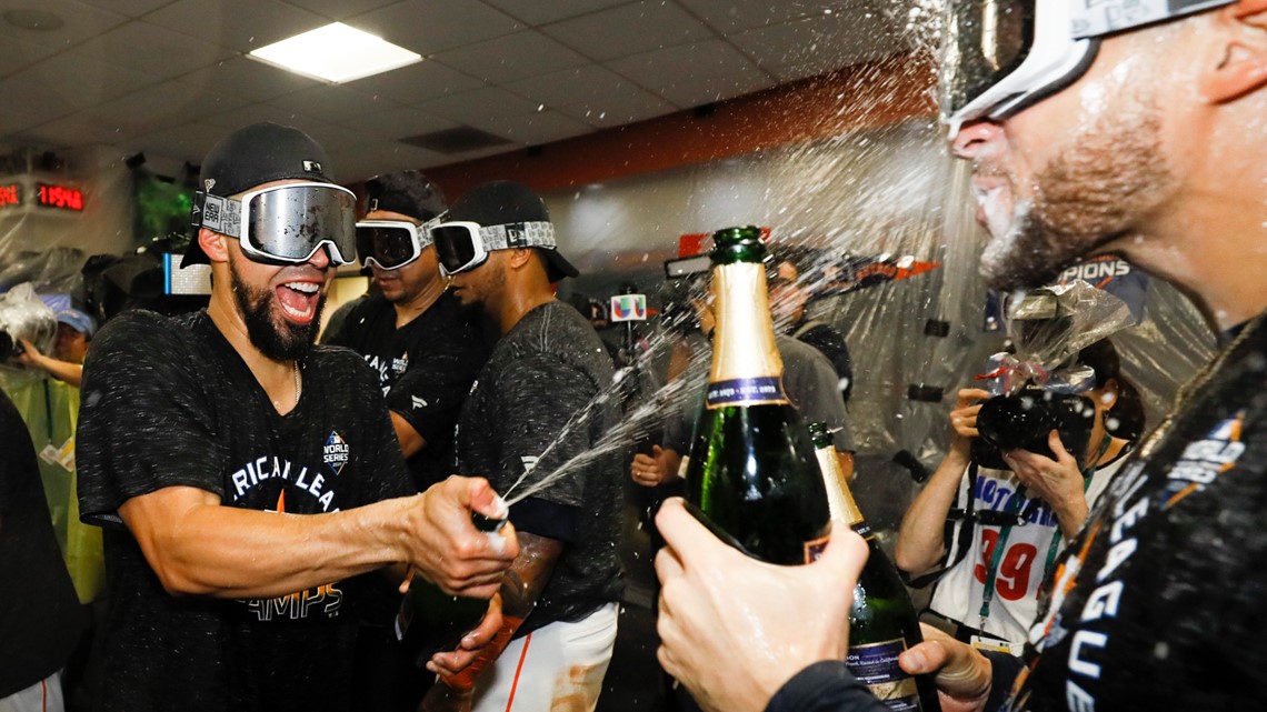 Houston Astros celebrate American League pennant with champagne
