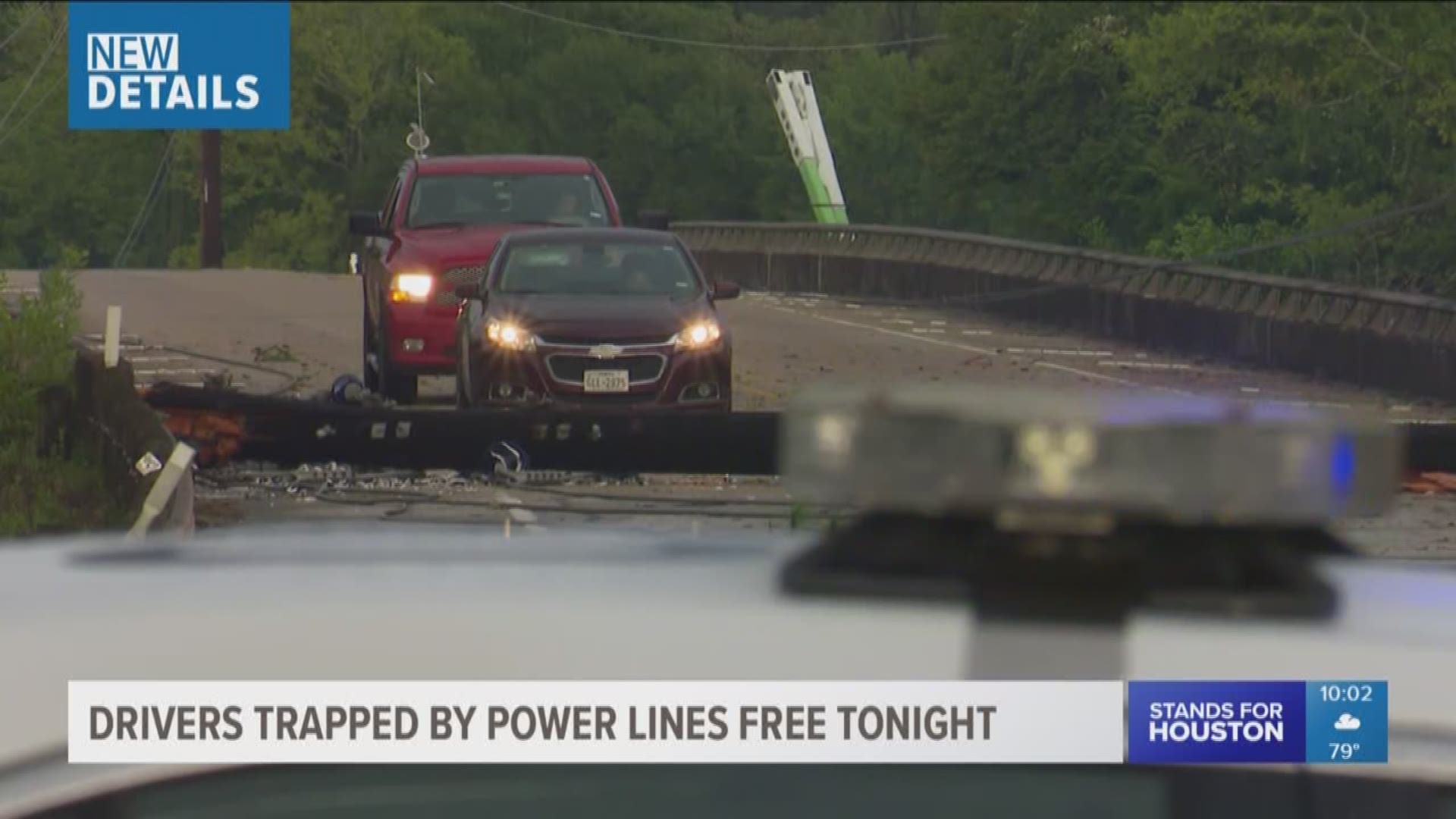 Three people were recused Friday after being trapped in cars for hours when wind and storms near Crosby brought down live power lines.